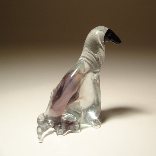 Front view of a handcrafted glass Afghan Hound figurine, showcasing the breed's elegant long fur and graceful stance.