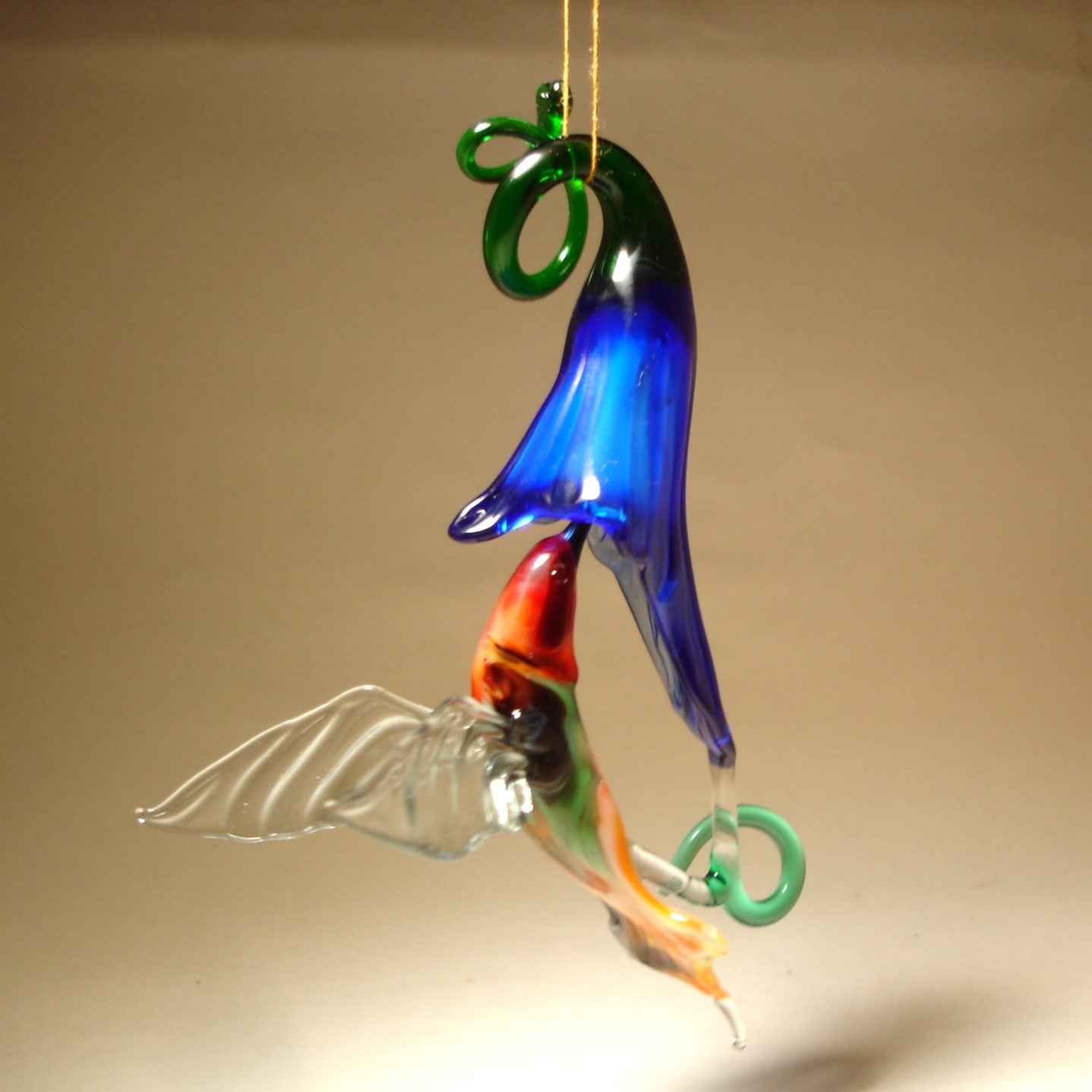 Handmade hummingbird and blue flower ornament