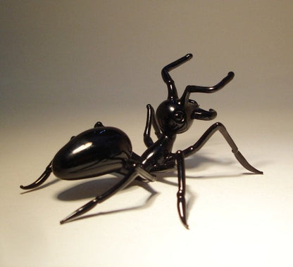 Back view of the glass ant figurine, focusing on the fine craftsmanship of its head and thorax 