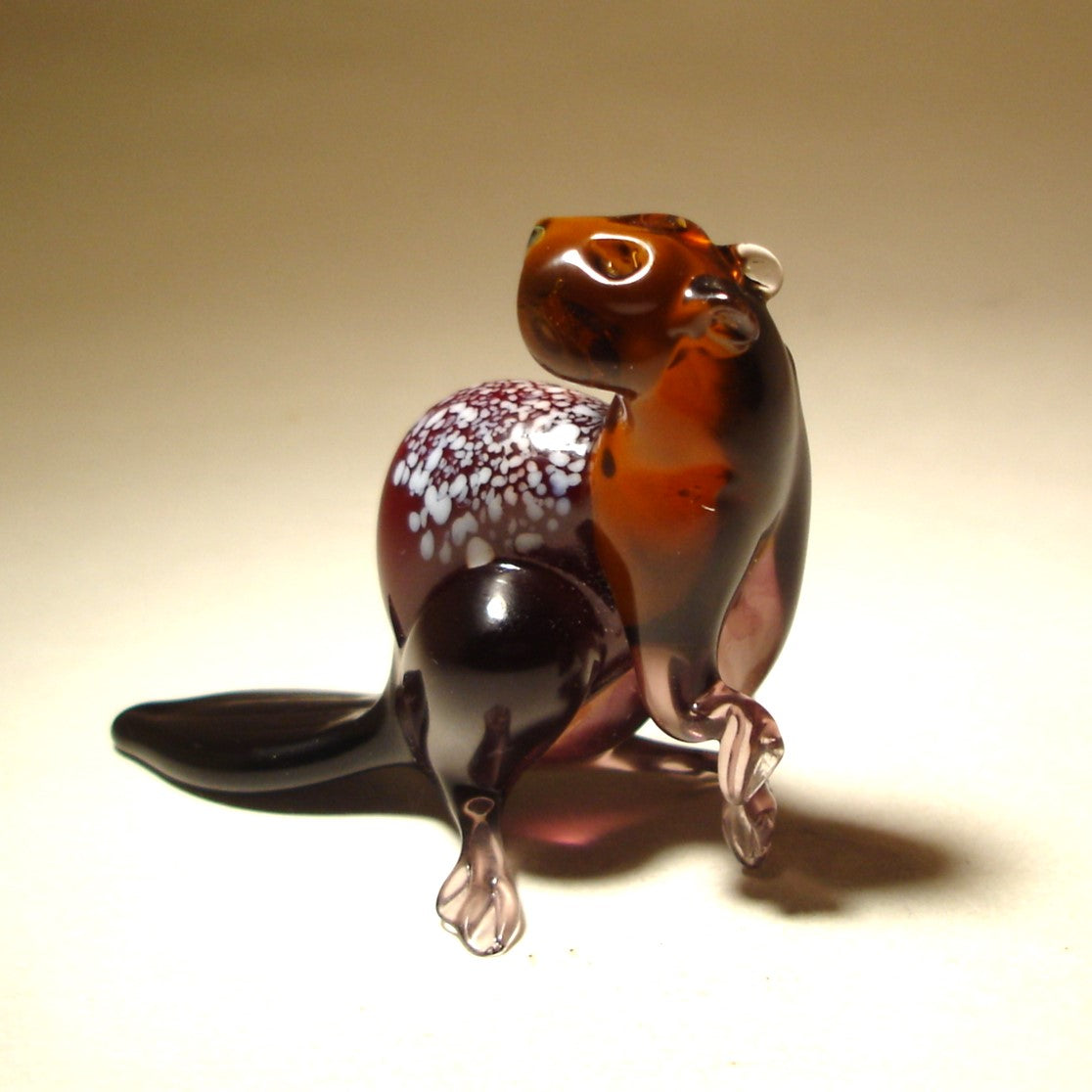 Front view of the glass beaver figurine, showcasing its detailed facial features and smooth glass finish