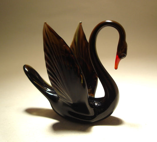 handcrafted black glass swan figurine, showcasing its graceful neck - right side view