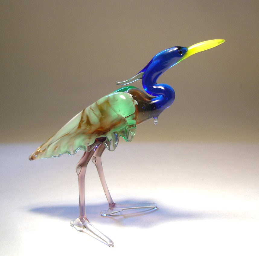 Front view of a glass blue neck heron figurine, showcasing its elegant stance and long, graceful neck.