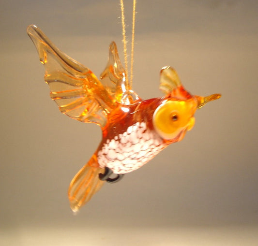 Handmade glass brown owl figurine ornament suspended from a string