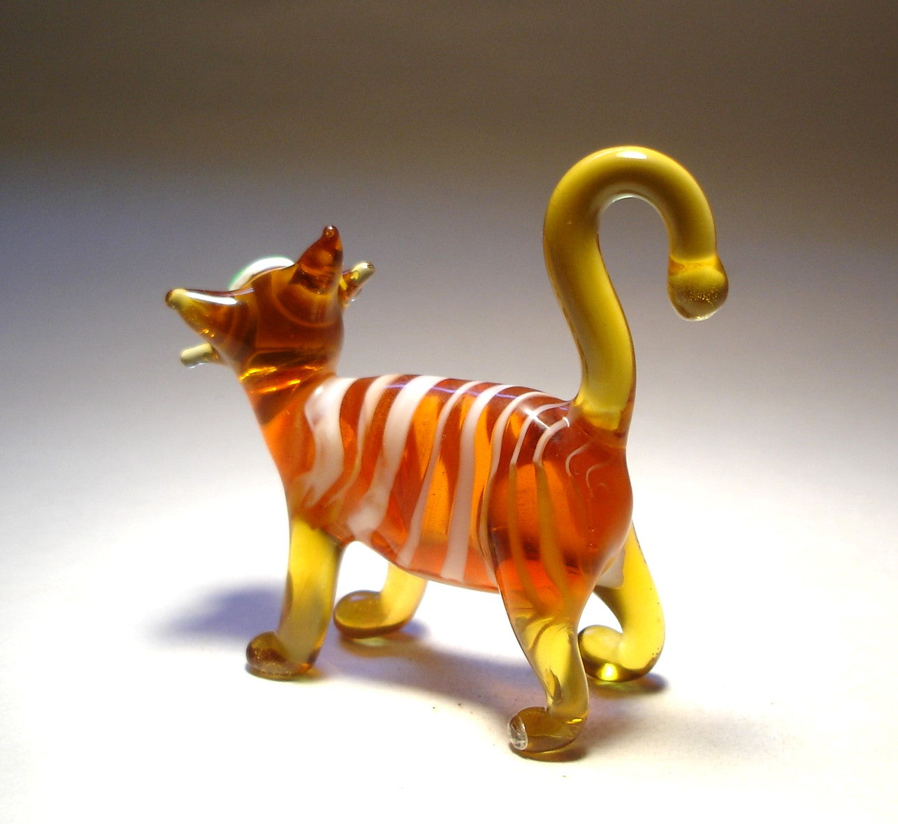 a back view of the striped brown cat figurine