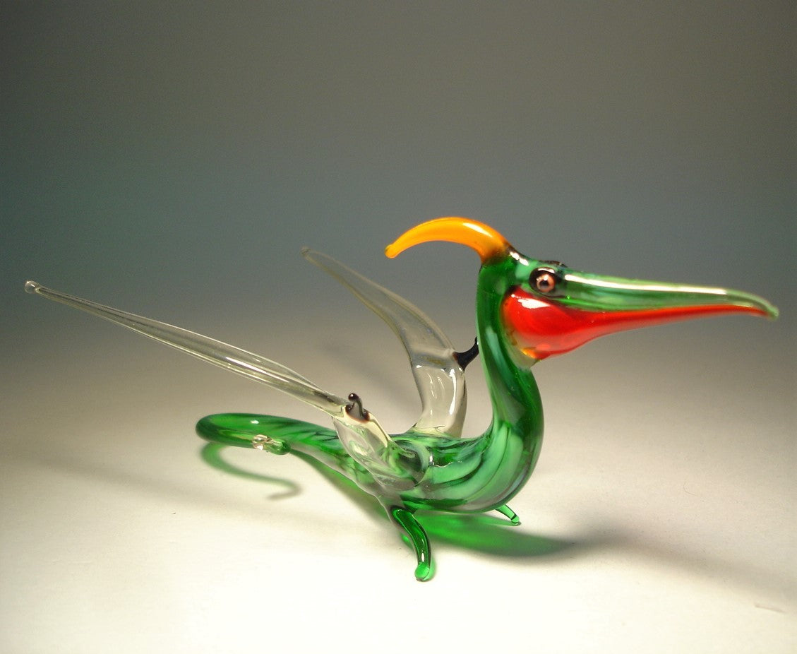 Front view of a glass Pterodactyl figurine with outstretched wings, capturing its elegant prehistoric form