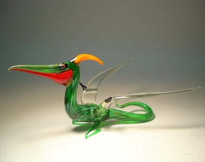 Side view of the glass Pterodactyl figurine, highlighting its detailed wings and elongated beak.