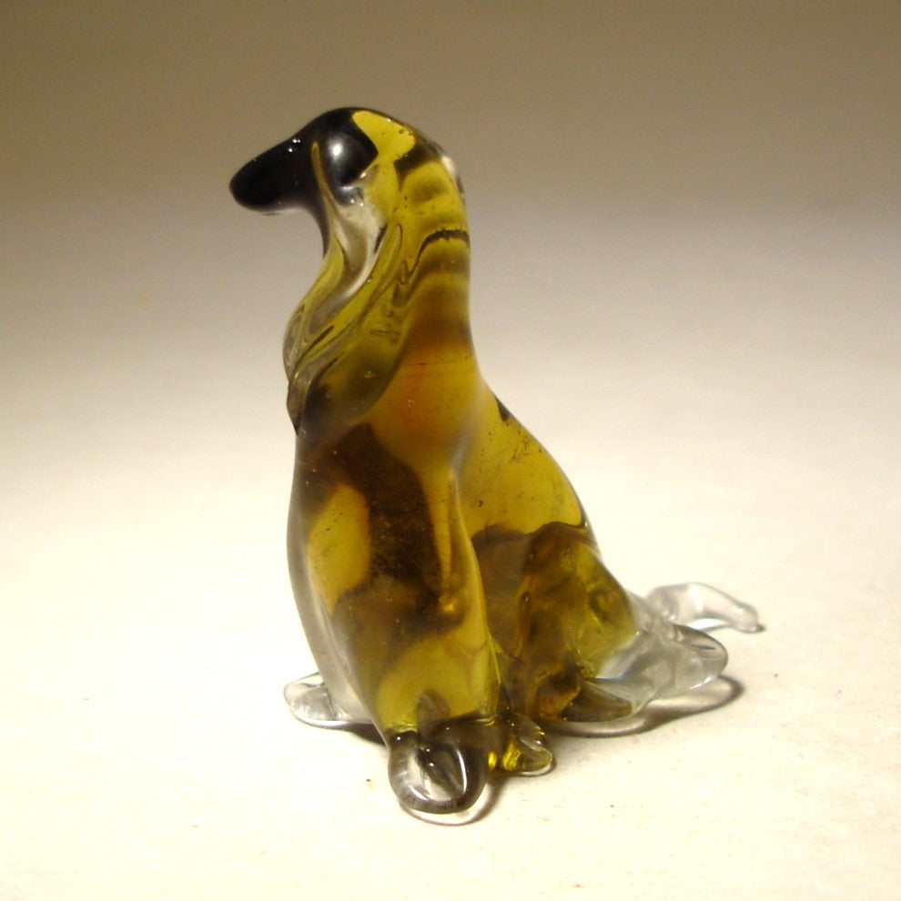 Side view of the glass Afghan Hound figurine, emphasizing the flowing fur details and poised body