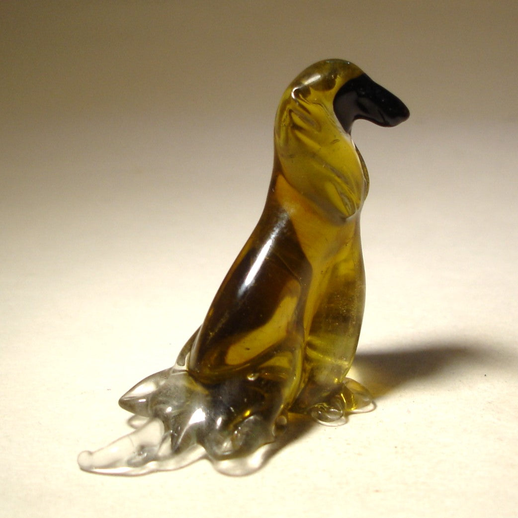 Front view of a handcrafted glass Afghan Hound figurine, showcasing the breed's elegant long fur and graceful stance.