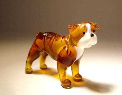 Close-up of the glass English Bulldog figurine’s face, capturing its distinctive wrinkled features and friendly expression.