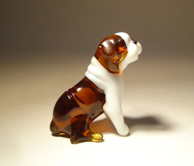 Close-up of the glass English Bulldog figurine, highlighting the intricate craftsmanship of its folded ears and robust body, perfectly capturing the breed's unique features.