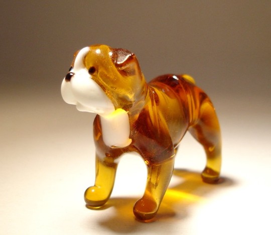 Handmade glass English Bulldog figurine sitting with its signature stocky build.