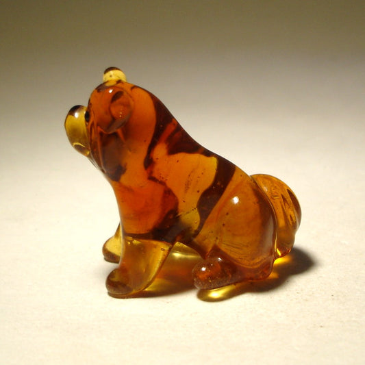 Handcrafted glass Chow Chow figurine in a sitting position, showcasing the breed’s thick fur and lion-like mane.