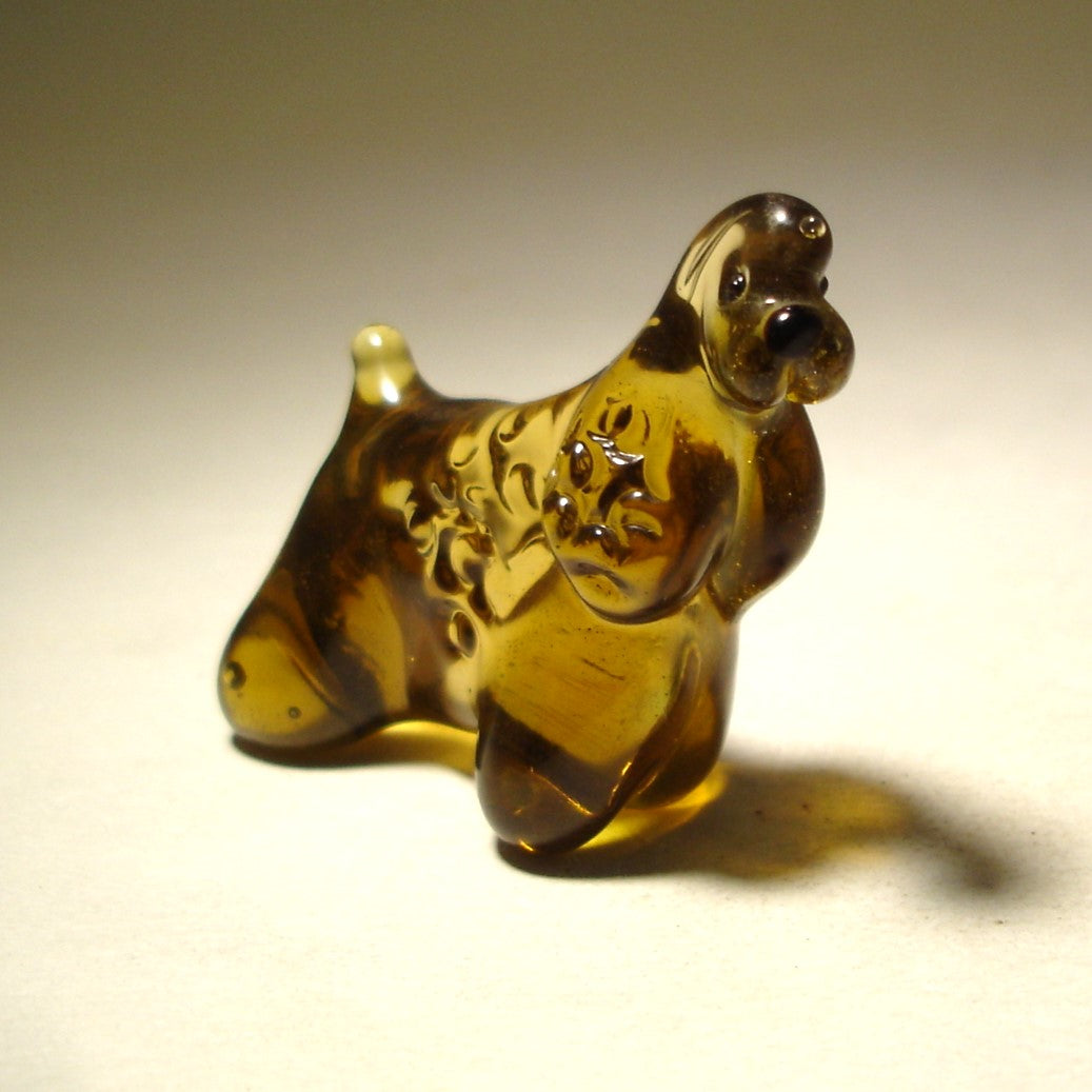 Close-up of the glass Cocker Spaniel figurine’s face, capturing its soft expression and finely detailed ears.