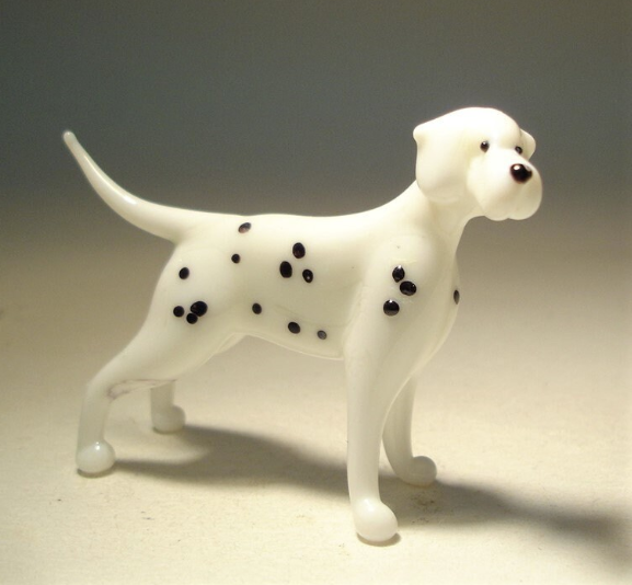 Handcrafted glass Dalmatian figurine standing with its signature black spots on a white body