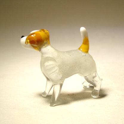 Side view of the glass Jack Russell Terrier figurine, highlighting its alert expression, high set tail, and detailed fur texture.