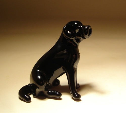 Side view of the glass Black Lab figurine, emphasizing its friendly expression and well-defined features, including the characteristic floppy ears