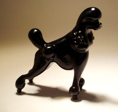 Black glass Poodle figurine in elegant and sturdy stance.