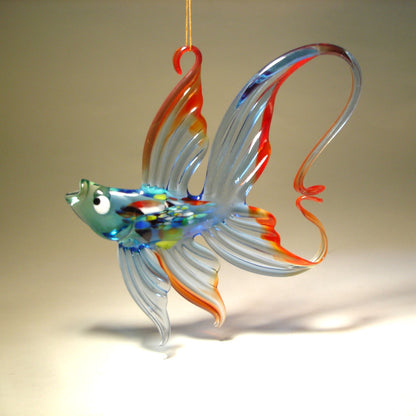 left side of the handcrafted blue glass fish ornament, focusing on the intricate detailing of the fins and the glossy finish of the glass