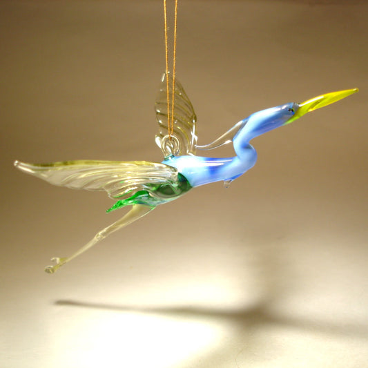 Close-up of the Glass Heron in Flight Hanging Figurine Ornament, capturing the heron's outstretched wings and detailed feathers as it soars.