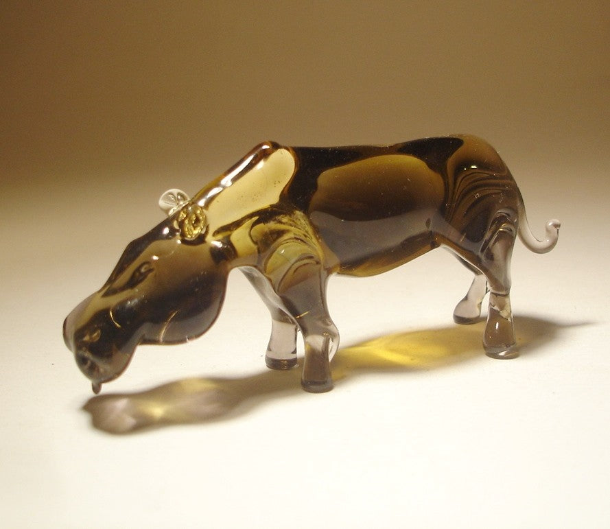 Side view of the Glass Hippopotamus Figurine, highlighting the smooth, glossy surface and short, sturdy legs.