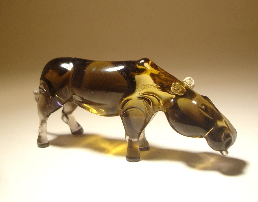 Angled view of a Glass Hippopotamus Figurine, emphasizing its detailed face and sculpted ears, giving it a realistic appearance.