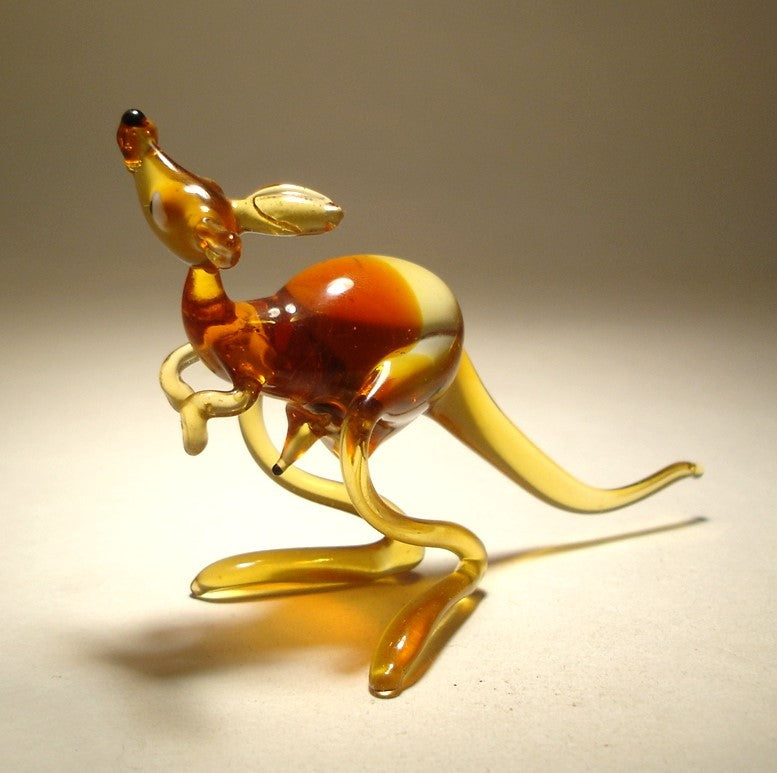 A side view of the glass kangaroo figurine, highlighting her alert stance.