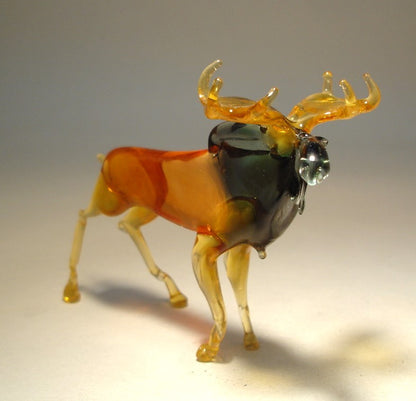 Front view of the glass moose's antlers and its face.