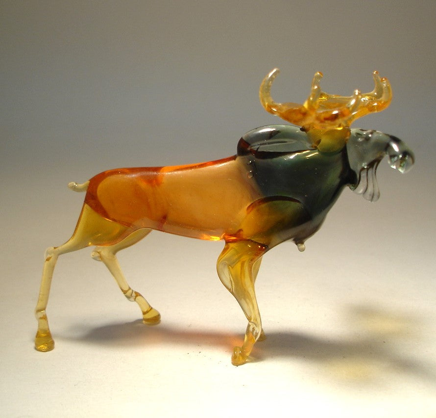 Side view of the glass moose figurine, showcasing its strong stance and elegant curves.