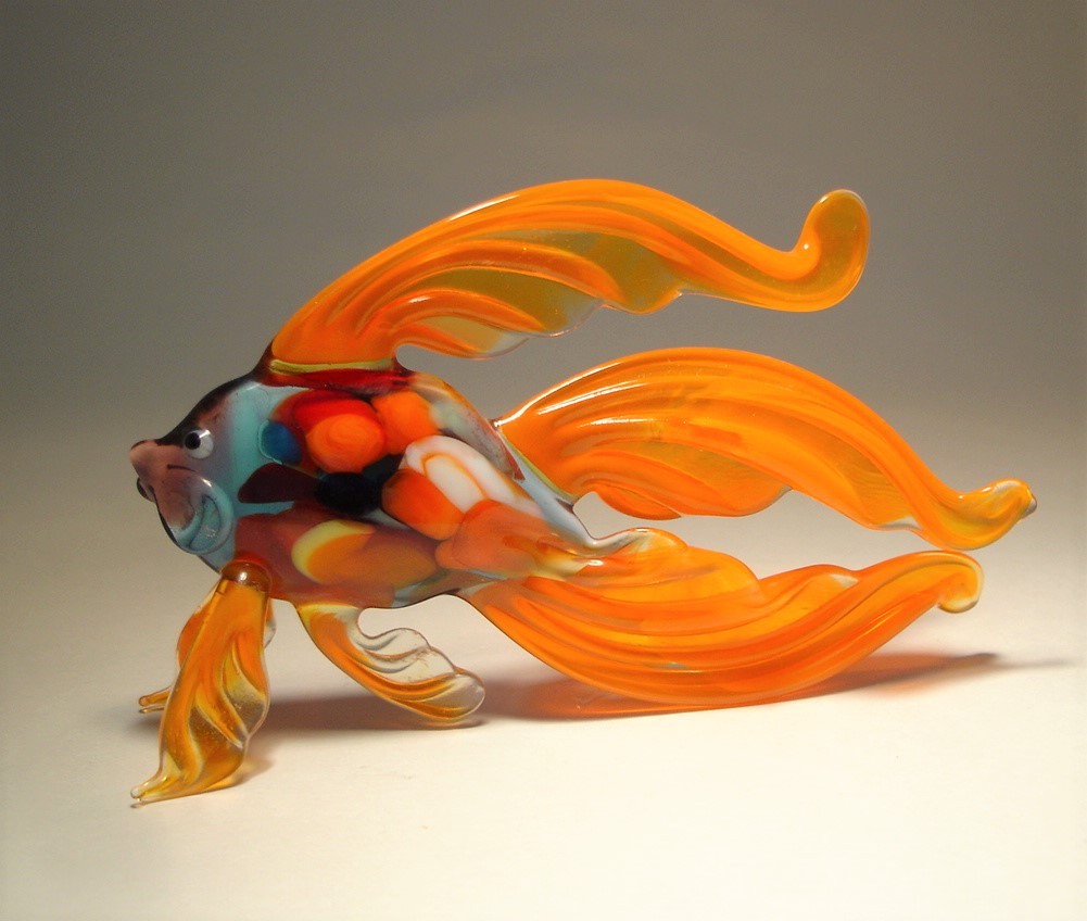 Another view of the orange Betta fish glass figurine, showing the elegant curvature of the fish’s body and the wide double tail.