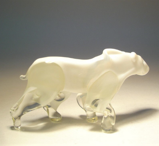 Side angle of the glass polar bear figurine, depicting the bear in a walking pose. 