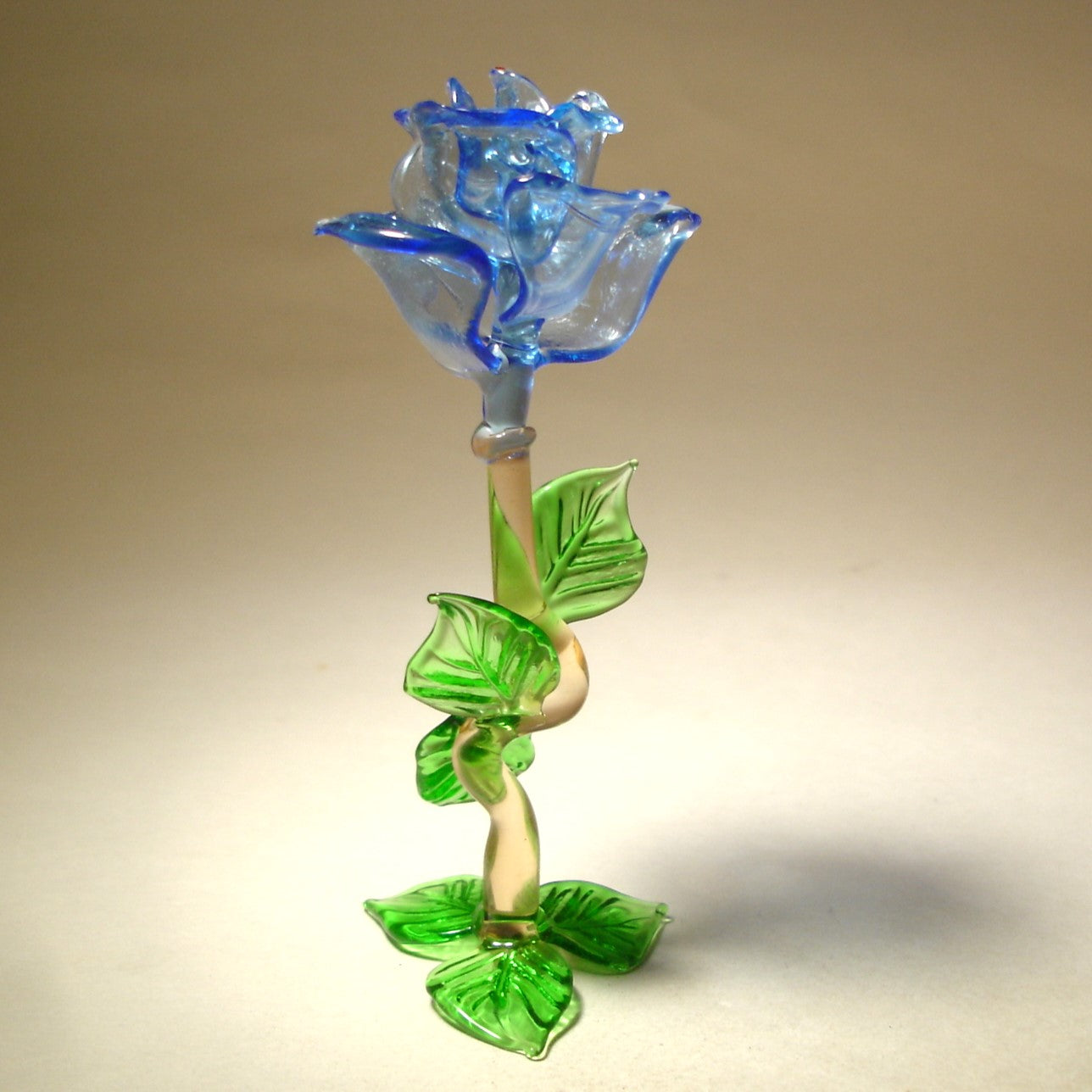 open glass blue rose standing