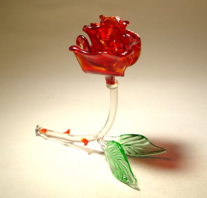 Front view of a dark red glass rose figurine, showcasing its rich color and delicate petals.