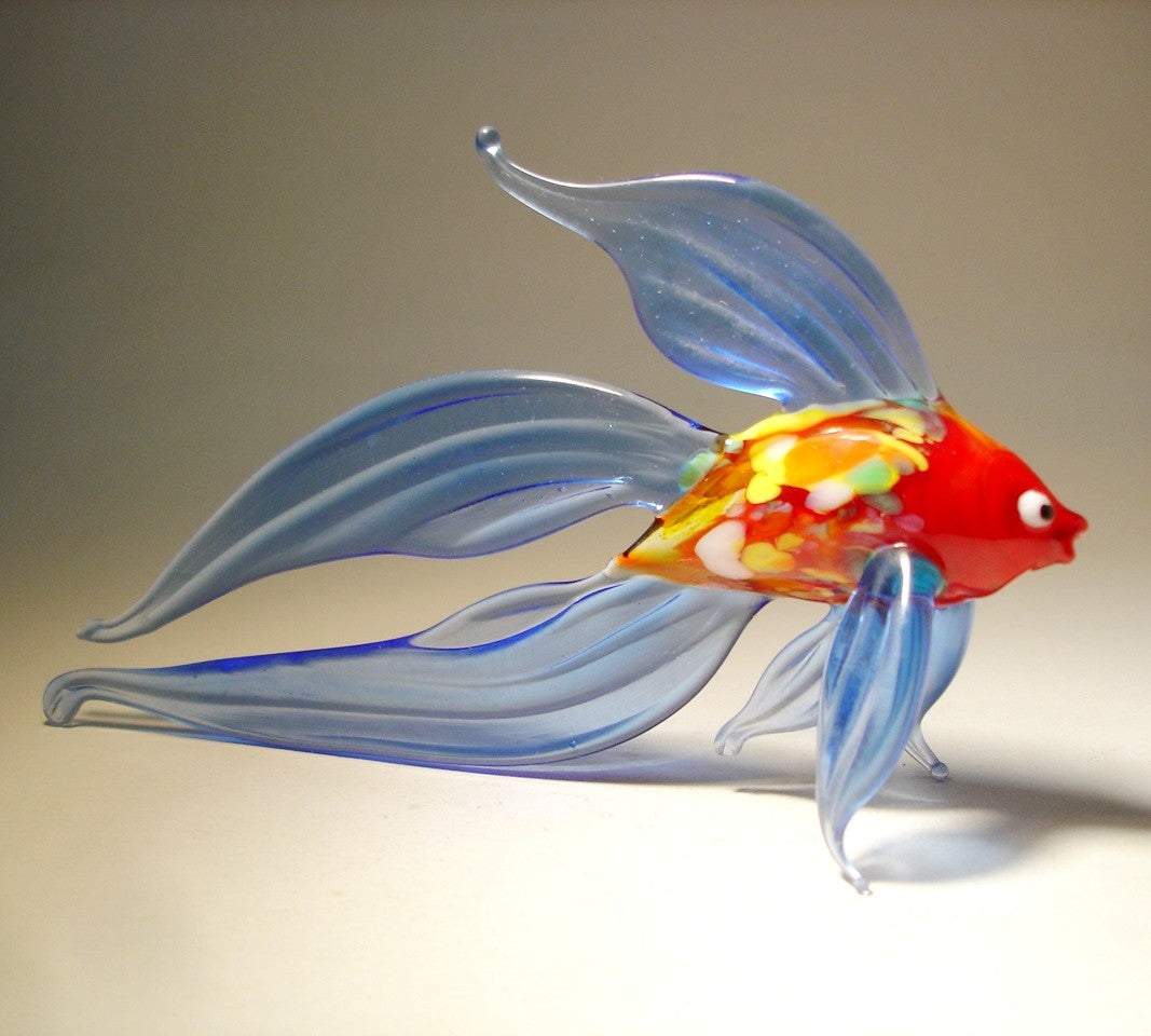 another side view of the blue glass betta fish figurine, highlighting the intricate fin details 