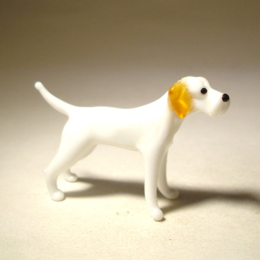 Handcrafted figurine of Great Dane dog in white with brown ears.